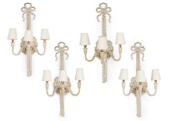 A SET OF FOUR OFF WHITE PAINTED CARVED AND COMPOSITION THREE BRANCH WALL LIGHTS, LATE 20TH CENTURY