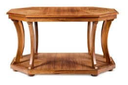 AN ELONGATED OCTAGONAL CHERRYWOOD CENTRE TABLEBY ANTONY LITTLE The crossbanded top on curved supp