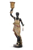 A POLYCHROME DECORATED RESIN MORETTO FIGURE, 20TH CENTURY