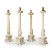 A SET OF FOUR ALABASTER COLUMN CANDLESTICKS IN THE CLASSICAL MANNER, PROBABLY ITALIAN