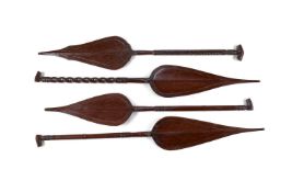 A SET OF FOUR MAHOGANY PADDLES