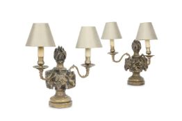 A PAIR OF CARVED AND PART SILVERED BAROQUE STYLE LAMP BASES, 19TH CENTURY IN THE 17TH CENTURY MANNER