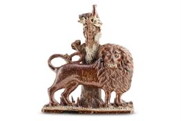 AN ENGLISH BROWN SALT-GLAZED STONEWARE BOCAGE MODEL OF A LION PASSANT, PROBABLY DERBYSHIRE