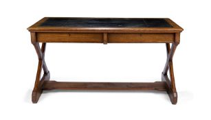 A VICTORIAN OAK X-FRAME WRITING-TABLE, BY HOWARD & SONS