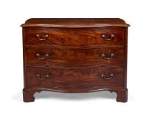 A GEORGE III MAHOGANY SERPENTINE COMMODE ATTRIBUTED TO THOMAS CHIPPENDALE