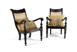 Y A PAIR OF CEYLONESE EBONY AND CANED ARMCHAIRS, 19TH CENTURY