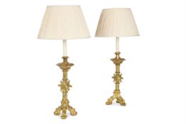 A PAIR OF FRENCH ORMOLU CANDLESTICKS, MID 19TH CENTURY IN THE MEDIEVAL MANNER