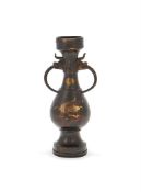 A Chinese gilt bronze dragon-handled vase