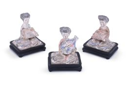 Three Chinese pottery figures of kneeling Court Ladies