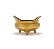 A Chinese bronze tripod censer