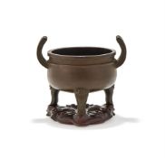 A Chinese bronze tripod censer