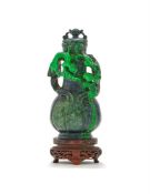 A small Chinese spinach green jade vase and cover