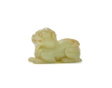 A Chinese celadon jade lion
