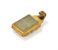 A gilt-bronze and celadon jade inlaid dragon belt buckle