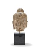 A Chinese carved stone buddha head