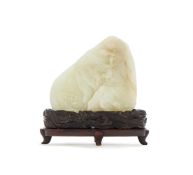 A Chinese carved white jade boulder