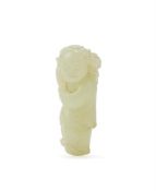 A Chinese pale celadon jade carving of a boy