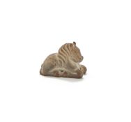 A small Chinese stone carving of a recumbent horse