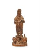 A Chinese wood standing figure of a guardian