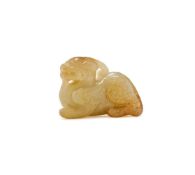 A Chinese pale celadon jade mythical beast