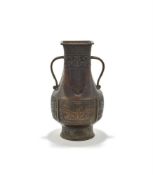 A large Chinese bronze twin handled vase