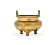 A Chinese lacquered bronze two-handled tripod censer