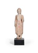 A large Chinese painted limestone standing figure of buddha