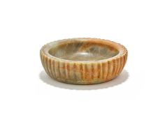A Chinese celadon jade 'Lotus' washer