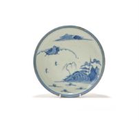 A Japanese Shoki Imari style blue-and-white dish