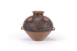 A Chinese red painted pottery twin handled vase