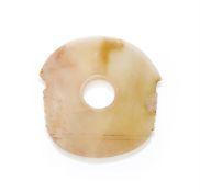 A Chinese pale celadon jade notched axe