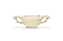 A Chinese pale celadon and white jade twin-handled cup
