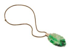 A Chinese carved jadeite 'Egret and Lotus' pendant