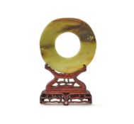 A Chinese celadon jade disc
