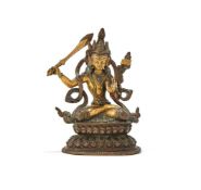 A parcel-gilt bronze figure of Manjusri