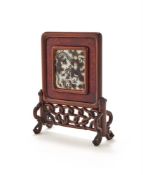 A Chinese porcelain en grisaille enamelled 'dragon' hardwood mounted screen