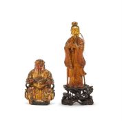 A Chinese carved wood and lacquered figure of a seated official