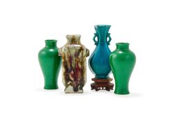 A pair of small green glazed finely crackled baluster vases