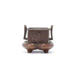 A Japanese bronze tripod censer