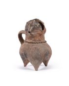 An anthropomorphic pottery tripod vessel