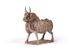 A Chinese painted grey pottery figure of an ox