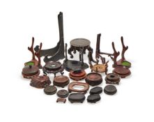 A group of twenty six carved wood stands