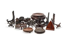 A group of twlve carved wood stands