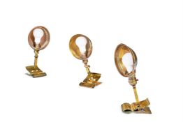 THREE BRASS CLIP-ON DESK LIGHTS, TWO EARLY 20TH CENTURY