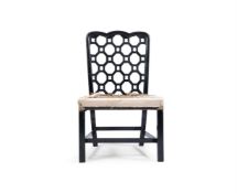 AN EBONISED WALNUT SIDE CHAIR OF GEORGE III STYLE