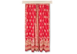 A PAIR OF RED FLORAL PATTERN CURTAINS