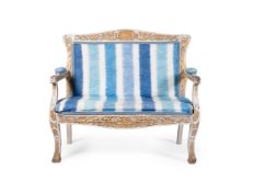 A WHITE PAINTED AND PARCEL GILT SETTEE, NORTH EUROPEAN