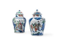 A PAIR OF WUCAI BALUSTER VASES AND COVERS, 17TH CENTURY