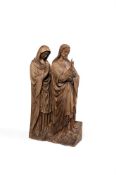 A CARVED OAK GROUP OF CHRIST AND MARY AT THE WEDDING AT CANA, FLEMISH
