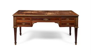 AN ORMOLU MOUNTED MAHOGANY BUREAU-PLAT OF LOUIS XVI STYLE